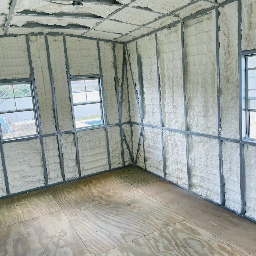 Closed-cell spray foam insulation applied to wall cavities in a residential project in Palm Harbor